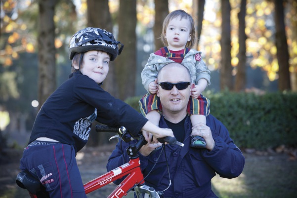 Dad walking with two young children